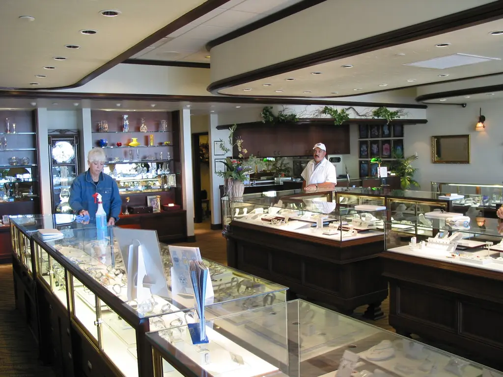 Wide view of the Melby's Jewelers showroom, with lit cases and a grandfather clock